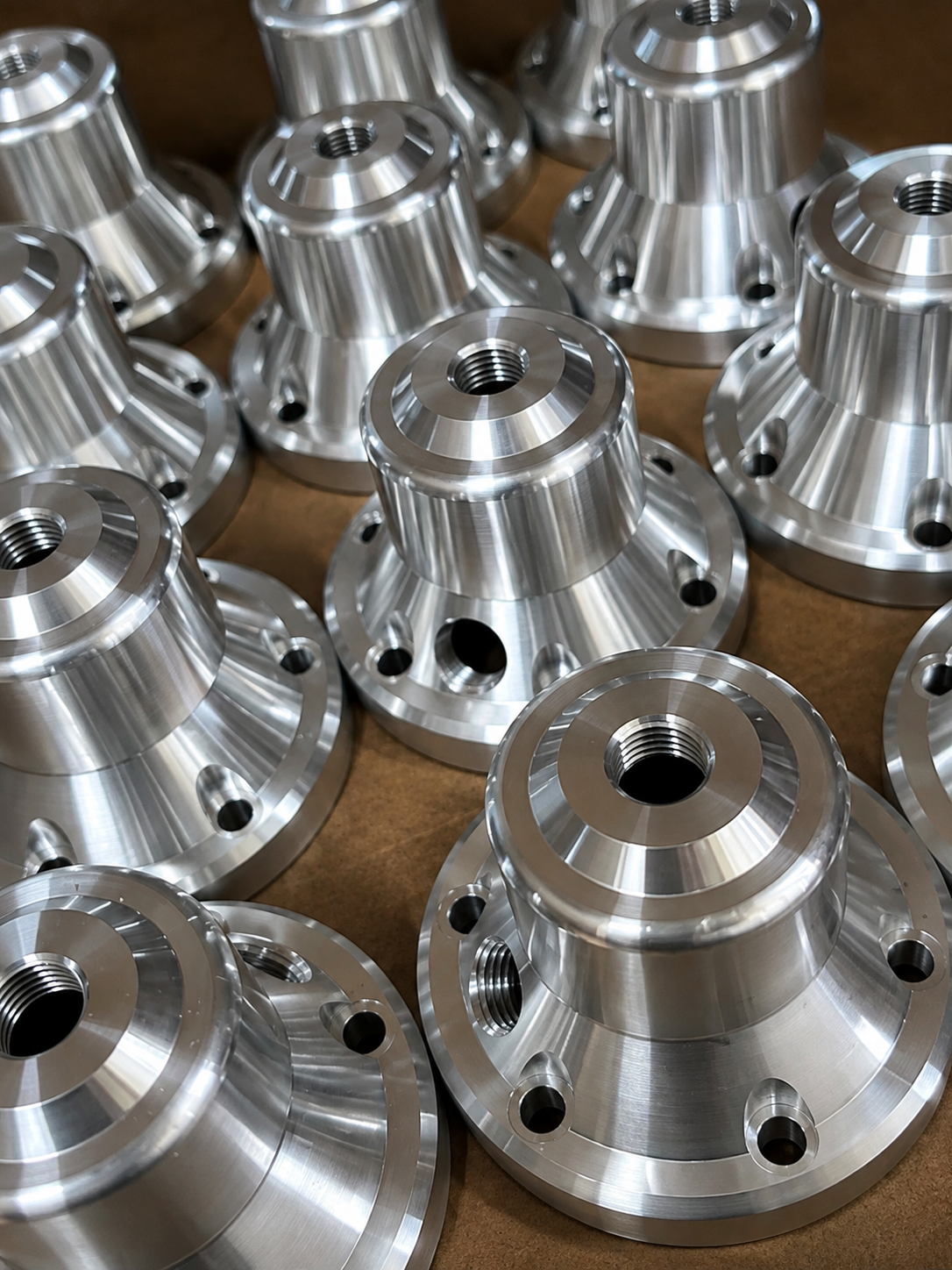 CNC-turned aluminum housings — Mikron Manufacturing precision machining