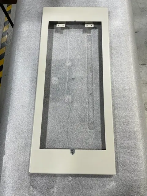 Front view of an access-panel weldment in Mikron’s fabrication portfolio
